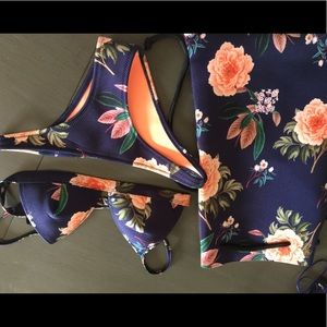 Floral print navy bikini set with matching bag